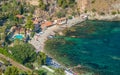 Ozy and relaxing bay with aquamarine water in Taormina. Province of Messina, Sicily, southern Italy. Royalty Free Stock Photo