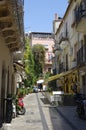 Mopeds parked in one of the side-street of famous Taormina town in August peak season of 2017er