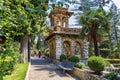 Taormina, Italy, 08/30/2016: Beautiful park with brick construction and dense vegetation