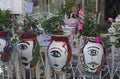 Typical balcony flower pots painted with human heads in Sicilia, Italy. Royalty Free Stock Photo