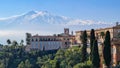 Taormina - Luxury San Domenico Palace Hotel with panoramic view on snow capped Mount Etna volcano in Taormina, Sicily Royalty Free Stock Photo