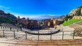 Taormina - Panoramic view of snow capped Mount Etna volcano seen from the ancient Greek theatre of Taormina, island Sicily, Italy Royalty Free Stock Photo