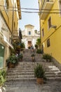 Yellow narrow street with stairs in Taormina old town in Sicily Italy