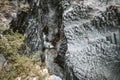 Tourists walking in Alcantara Gorge and Alcantara river park in Sicily Island, Italy