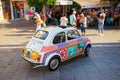 Taormina, Sicily, Italy - 28 September 2023: A vintage Fiat 500 vehicle beautifully decorated with Sicilian pictorial elements in