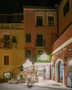 Taormina Sicily, old streets of Taormina during evening with the lights on and people on the terrace