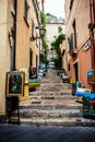 Taormina stairs street with paintings by local authors Royalty Free Stock Photo