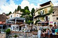 Taormina street with tourists and restaurants