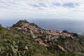 Taormina town on a hillside with panoramic view on surrounding mountains and Ionian sea Royalty Free Stock Photo