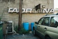 Taormina Trattoria vintage sign with old Subaru, Peekskill, New York