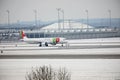 TAP Air Portugal plane on runway in Munich Airport, Germany, Winter time with snow Royalty Free Stock Photo