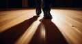 Tap dancers feet on stage with long shadows Royalty Free Stock Photo