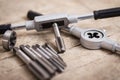 Tap die on a wooden table Royalty Free Stock Photo
