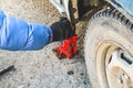 tap the wrench to replace the deflated wheel on the machine. Royalty Free Stock Photo