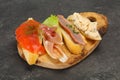 Tapas - bruschetta with prosciutto, salmon, duck and gorgonzola Royalty Free Stock Photo