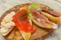 Tapas - bruschetta with prosciutto, salmon, duck and gorgonzola Royalty Free Stock Photo