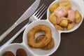 Tapas fried squid rings and potates braves