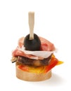 Tapas with jamon and eggplant and bell pepper on white background