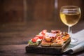 Tapas and wine served on wooden board