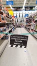 Tape closing off non-essential shopping items in a major supermarket. A national lockdown sees the sale of non-essential items