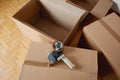 Tape dispenser sealing a shipping cardboard box Royalty Free Stock Photo