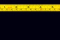 Tape measure centimeters and millimeters on the yellow ruler Royalty Free Stock Photo