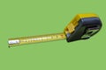 Tape measure on green background Royalty Free Stock Photo