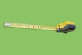 Tape Measure on green background Royalty Free Stock Photo