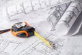 Tape measure over a construction plan drawing