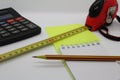 Tape measure pencil and notepad on a light background Royalty Free Stock Photo