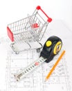 Tape measure with pencil and shopping cart