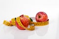 Tape measure and red apple Royalty Free Stock Photo