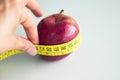 Tape measure surrounding a red apple Royalty Free Stock Photo