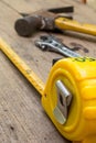 Tape measure,tape measure on the brown wooden background Royalty Free Stock Photo