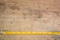 Tape measure,tape measure on the brown wooden background