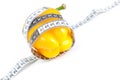 Tape measure and yellow pepper isolated on white Royalty Free Stock Photo
