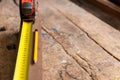 Tape measurer , wood board, yellow pencil Royalty Free Stock Photo