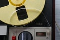 The tape on the reel of the magnetic tape recorder, close-up of buttons Royalty Free Stock Photo