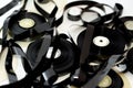 Tape ribbons with the supply and take up reels of VHS video cassette tapes used on old video players and recorders, retro style Royalty Free Stock Photo