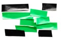 Tape roll. Black adhesive paper and green sticky piece scotch isolated on white background. Torn strip grunge texture Royalty Free Stock Photo