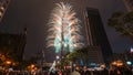 Taipei City Night landscape and Taipei 101 skyscraper is lit up by fireworks. People watching and taking photos and videos. Royalty Free Stock Photo