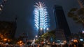 Taipei City Night landscape and Taipei 101 skyscraper is lit up by fireworks. People watching and taking photos and videos around Royalty Free Stock Photo