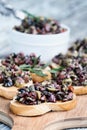Tapenade on Toasted Bread over Cutting Board Royalty Free Stock Photo