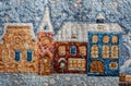 Tapestry fragment winter city landscape houses under snow close-up background