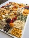 A tapestry of intricate 3D printed snacks arranged nonchalantly offering an eclectic mix of tastes and textures.. AI