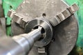 Tapping on a lathe, the tap cuts the hole by applying pressure from the tailstock