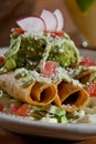 Taquitos and guacamole