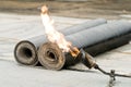Tar roofing felt roll and blowpipe Royalty Free Stock Photo