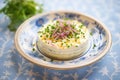 taramasalata in a decorative dish with chives sprinkled on top