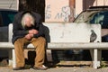 Taranto, Apulia / Italy - 03/23/2019 : A lost homeless old man depressed on bench Royalty Free Stock Photo